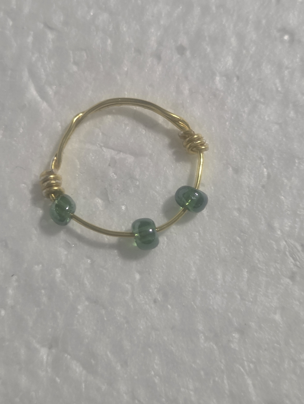 Handcrafted Gold Wire Ring with Green Bead Accents